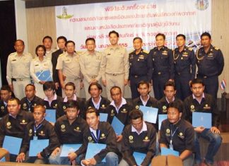 Royal Thai Air Force officers present certificates and Civil Affairs logos to Mayor Itthiphol Kunplome, Deputy Mayor Wutisak Rermkitkarn and 15 other Sanitation, Water and Engineering department workers.